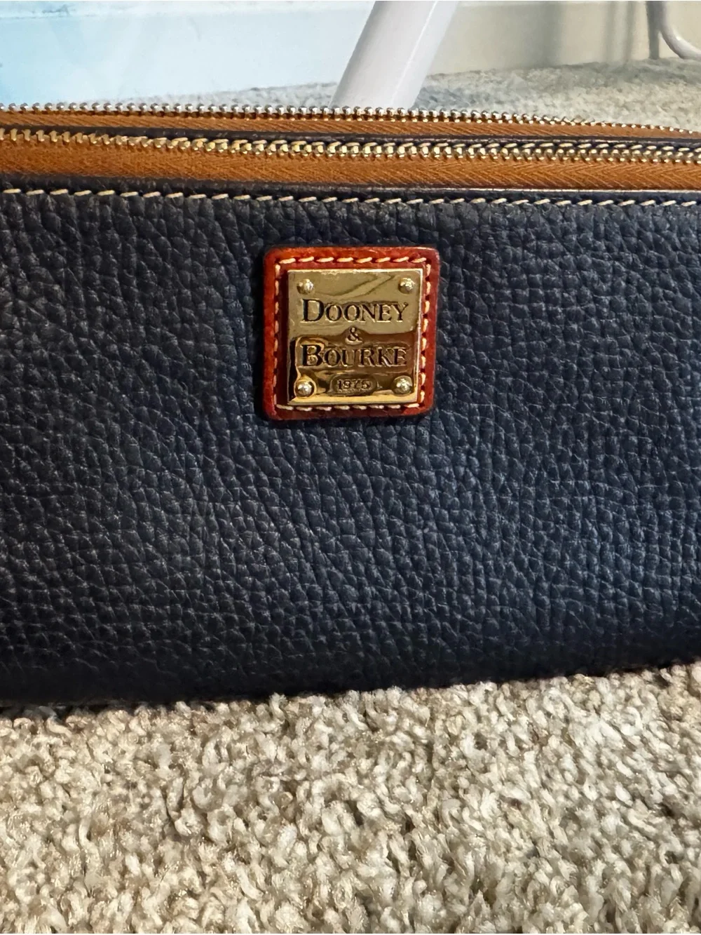 Dooney & Bourke Navy Pebbled Leather Zip Wristlet with Brown Trim